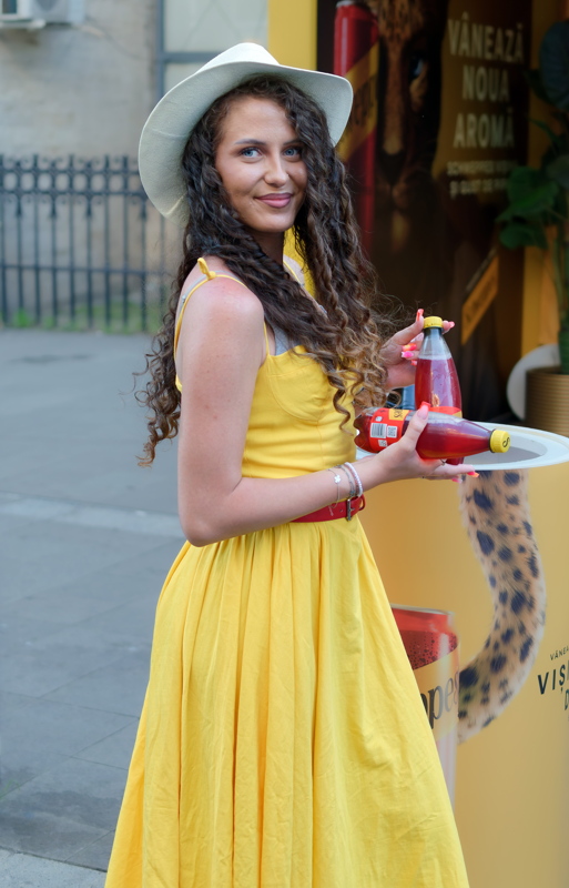 3 - Woman in a yellow swing dress from Collectif featuring white trim and a sweetheart bodice
